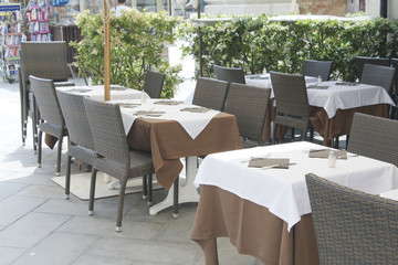 Empty tables of sidewalk cafe