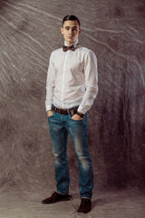 Fototapeta premium full length portrait of a casual young man standing with both