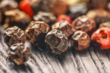 pepper corns on a wooden board