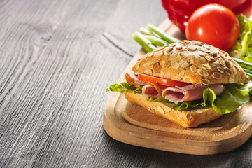 Sandwich with ham, tomatoe and radish
