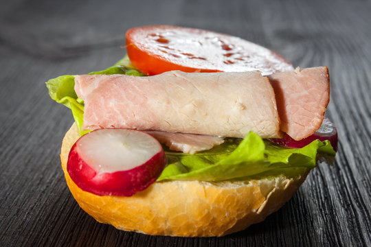 Ham, salad submarine sandwich from freshly cut baguette