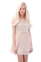 Sexy blonde woman posing with wind in the hair and dress