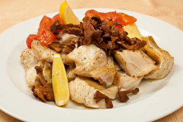 Fish baked with mushrooms