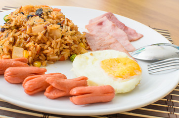 American fried rice with pork sausage, bacon and fried egg