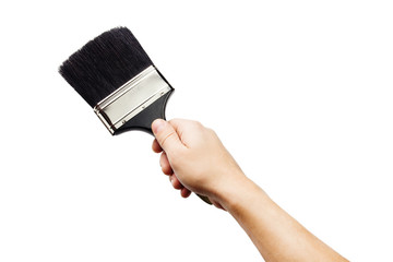 Hand holding big paintbrush isolated on white