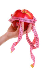 Female hands holding apple. Woman recommending healthy food.