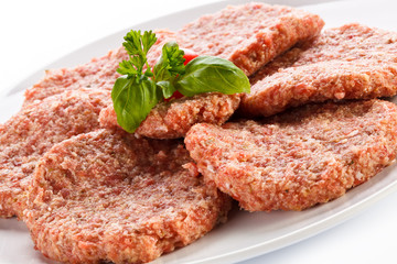 Raw minced pork chops meat on white background
