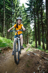 Fototapeta na wymiar Healthy lifestyle - teenage girl cycling