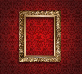 Antique golden frame on red wallpaper. - 59948397