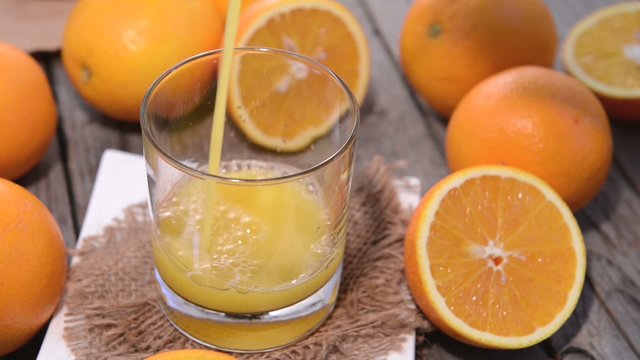 Filling Orange Juice in a glass