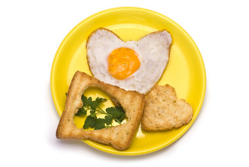 Romantic Breakfast: heart-shaped fried egg, heart-shaped toasts 