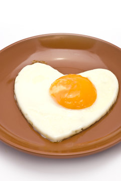 Heart-Shaped Fried Egg on Brown Plate