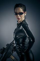 Naklejka premium Machine gun, Sexy girl military woman posing with guns.