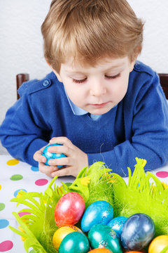 Little Toddler Boy Being Happy About Selfmade Easter Egg In Kind