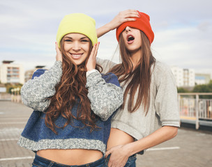 Two young  hipster girl friends