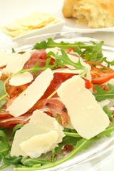 italian style salad with cured ham and shaved parmesan