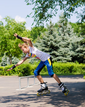 Teenage girl roller blading in a skate park