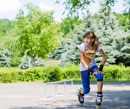 Teenage girl limbering up before skating