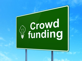 Finance concept: Crowd Funding and Light Bulb on road sign
