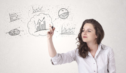 Young lady sketching financial chart icons and symbols