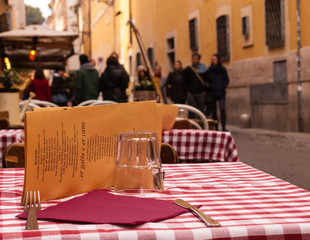 Close-up on a table of an outdoor Italian restaurant