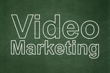 Finance concept: Video Marketing on chalkboard background