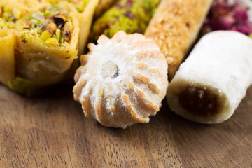 Heap of Gourmet Cookies on Rustic Wooden Board