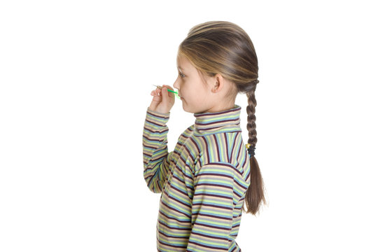 little girl is preparing to throw a dart