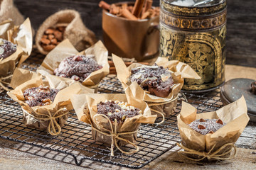 Chocolate muffins with nuts and icing sugar