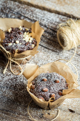 Closeup of decorating sweet muffins with string