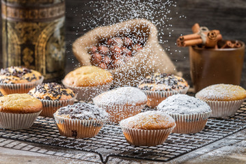 Falling powder sugar on vanilla muffins
