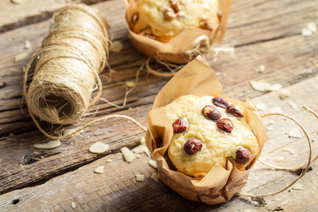 Closeup of decorating vanilla muffins with string