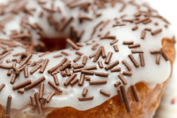 Closeup of donut decorated with chocolate sprinkles