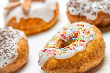 Freshly baked donuts with sprinkles