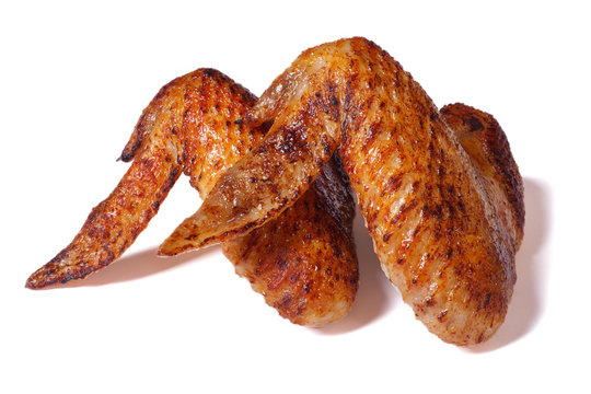 Two fried chicken wings with a crispy crust isolated on white