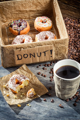 Box full of donuts with coffee