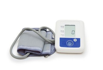 Digital blood pressure meter on white background
