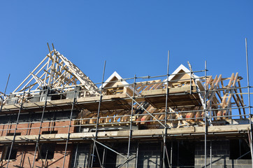 Roof under construction under blue sky