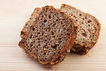 slices of bread over wooden background