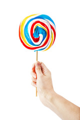 Hand holding lollipop isolated on white background