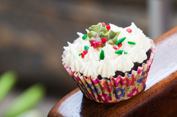 christmas cupcakes on a wooden chair