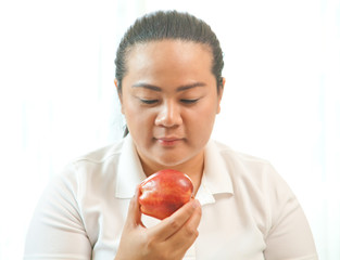 Fat woman with apple