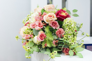 Colorful flower bouquet on the white table