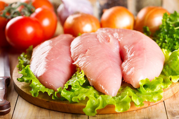 Raw chicken breast with vegetables