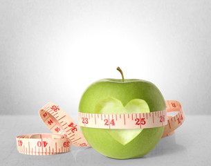 Green apples measured the meter on  white