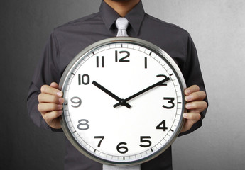 Businessman with alarm clock