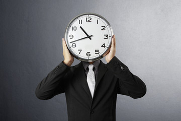 Businessman with alarm clock
