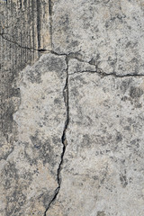 Cracked concrete texture closeup background.