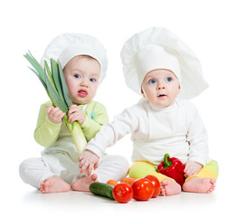 kids boy and girl wearing a chef hat with healthy  food vegetabl