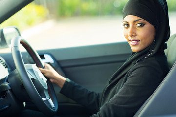 modern muslim woman in a car